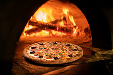 Image Of A Brick Pizza Oven With Fire
