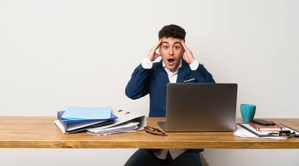 Business man in a office with surprise expression