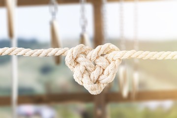 Sticker - White rope in heart shape knot on background. Love concept.