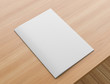 © Salih - Sotfcover magazine, catalogue or brochure mock up on wooden table. A4 format. 3D illustration.