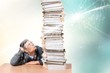 © BillionPhotos.com - Young man looking on huge stack of papers, isolated on white background