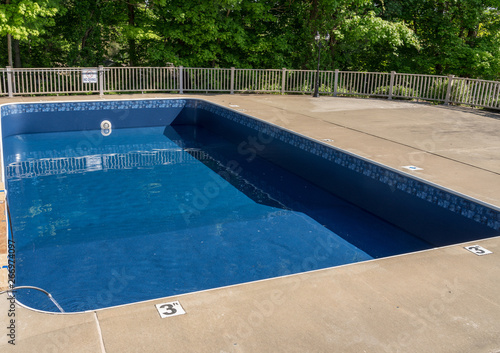 Fotomural In ground swimming poolwith new vinyl liner being refilled with water ready for