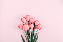 Beautiful Composition Spring Flowers. Bouquet Of Pink Tulips Flowers On Pastel Pink Background. Valentine's Day, Easter, Birthday, Happy Women's Day, Mother's Day. Flat Lay, Top View, Copy Space
