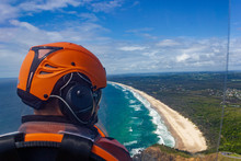 Head Of A Pilot In A Gyrocopter With Wategoes Beach In The Background, Byron Bay, Queensland, Australia
