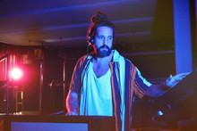 Bearded Dj Man Playing Disco Music In A Club
