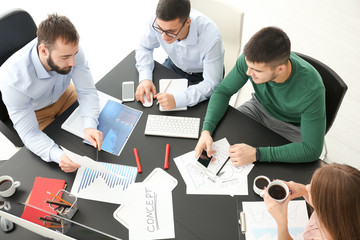 Poster - Young marketing expert with team at business meeting