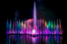 The Colorful Fountain Dancing In Celebration Festival With Dark Night Sky Background.