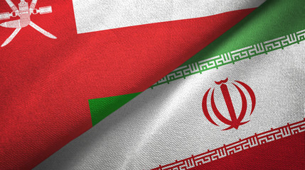 Oman and Iran two flags textile cloth, fabric texture