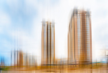 Abstract view of high buildings with a blue and cloudy sky