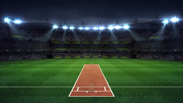 Wall Mural -  - Illuminated round cricket stadium full of fans at night upper front view