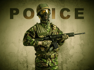 Uniformed armed soldier with damaged wall background
