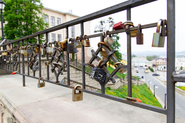 Padlocks of happiness on the bridge in city Chernovtsy, Western Ukraine