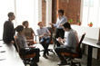 © fizkes - Female boss hold casual meeting brainstorming with employees