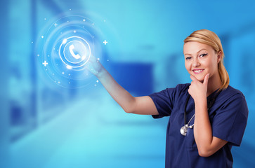 Wall Mural - Doctor touching blue screen with call center concept
