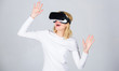 © be free - Excited smiling businesswoman wearing virtual reality glasses. Woman wearing virtual reality goggles. Pretty woman playing game in virtual reality glasses. VR games.