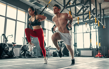 Wall Mural - Sporty couple in gym