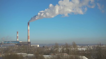 Wall Mural - Time lapse, pipes with smoke of thermal power station in winter at beautiful sunny day.
