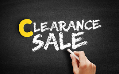 Clearance sale text on blackboard, business concept background