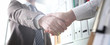 © Тихон Купревич - Man in suit and tie give hand as hello in office closeup. Friend welcome mediation offer positive introduction thanks gesture summit participate executive approval motivation male arm strike bargain