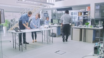 Leinwandbilder - In the Busy Engineering Facility: Diverse Group of Engineers, Technicians, Working on Design for Industrial Engine Prototype. Specialists Talk During Meetings, Work with Drawings, Use Computers