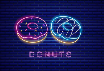 Wall Mural - Donuts neon symbols Vector. Glowing sign dark background. Shinning billboard or menu templates