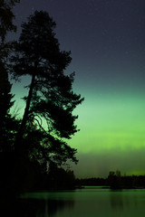 Wall Mural - Beautiful northern lights over lake