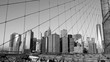 Manhattan buildings view from Brooklyn Bridge, black and white, New York, USA