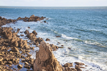 Blue water and Rocks at the beach .