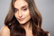 © cherry_d - Brunette girl with healthy curly hair and natural make up . Beautiful model woman with wavy hairstyle .Care and beauty