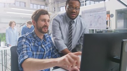 Fototapete - In the Industrial Engineering Facility: Portrait of the Handsome Male Engineer Working on Desktop Computer, Chief Engineer Stands Beside Overseeing Project. They Succeed and Cheerfully do High Five
