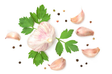 Wall Mural - Mediterranean food ingredients - bulbs of garlic with parsley and pepper isolated on a white background