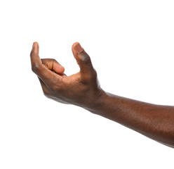 Wall Mural - African-American man holding something in hand on white background, closeup