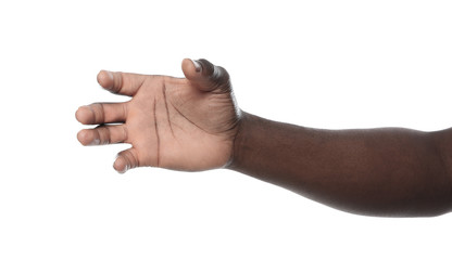 Wall Mural - African-American man holding something in hand on white background, closeup