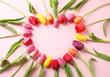 Fototapeta Tulipany - Heart made of beautiful tulip flowers on color background, flat lay. Space for text