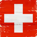 Fototapeta  - Flaga Szwajcarii malowana na starej desce.