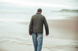 © Aitor - Man walking at Oyambre beach in Cantabria, north of Spain