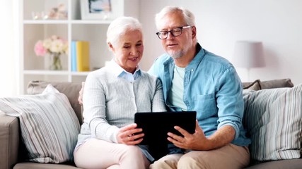 Sticker - family, technology, age and people concept - happy senior couple with tablet pc computer at home