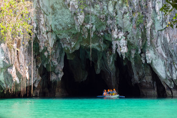 Palawan, Philippines - May 3, 2019: A boat with tourists at the entrance to the underground river in Puerto Princesa Subterranean River National Park