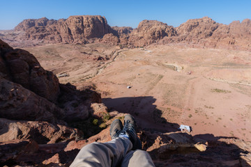 Wall Mural - travelling, hiking and adventurous in desert middle-east. traveler enjoying high angle view of deser