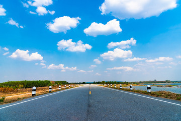 Wall Mural - blue sky background with clouds and empty road.