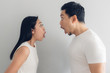 © Sevendeman - Surprised and shocked couple lover in white t-shirt and grey background.