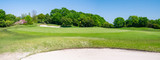 Fototapeta Miasto - Panorama View of Golf Course with beautiful green. Golf is a sport to play on the turf.	