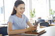 © Nguyen - Asian pretty attractive woman working on laptop computer in coffee show with bright optimistic background