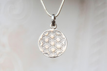 Silver Flower Of Life Sacred Geometry Pendant On Natural White Background