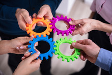 Group Of Businesspeople Connecting Gears