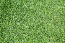 Background Of Faux Green Grass. Texture Backgrounds.