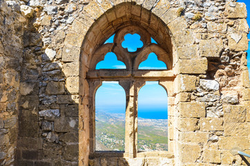 Beautiful window view from ancient St. Hilarion Castle in Northern Cyprus. The amazing view point offers a beautiful view over Cypriot Kyrenia region and Mediterranean. Popular tourist attraction