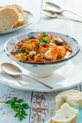 Canvas Print - Tiger prawn and fish stew in a bowl