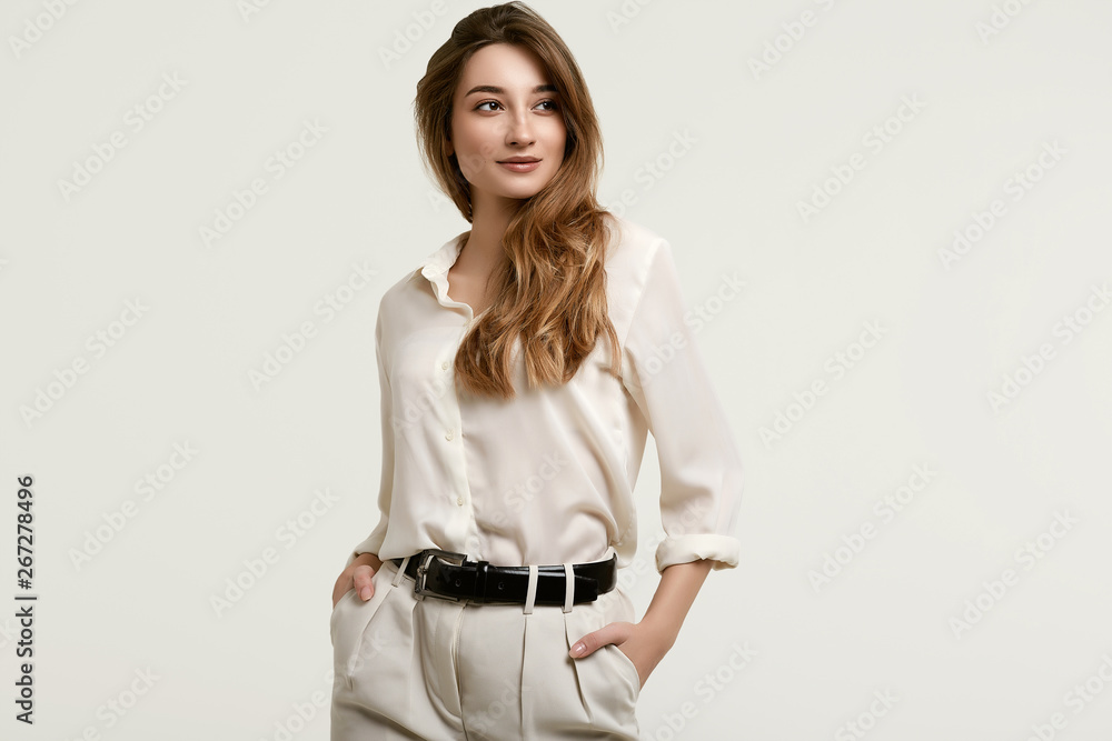 Gorgeous female brunette model in white clothes - obrazy, fototapety, plakaty 