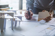 © Chaosamran_Studio - architect design working drawing sketch plans blueprints and making architectural construction model in architect studio